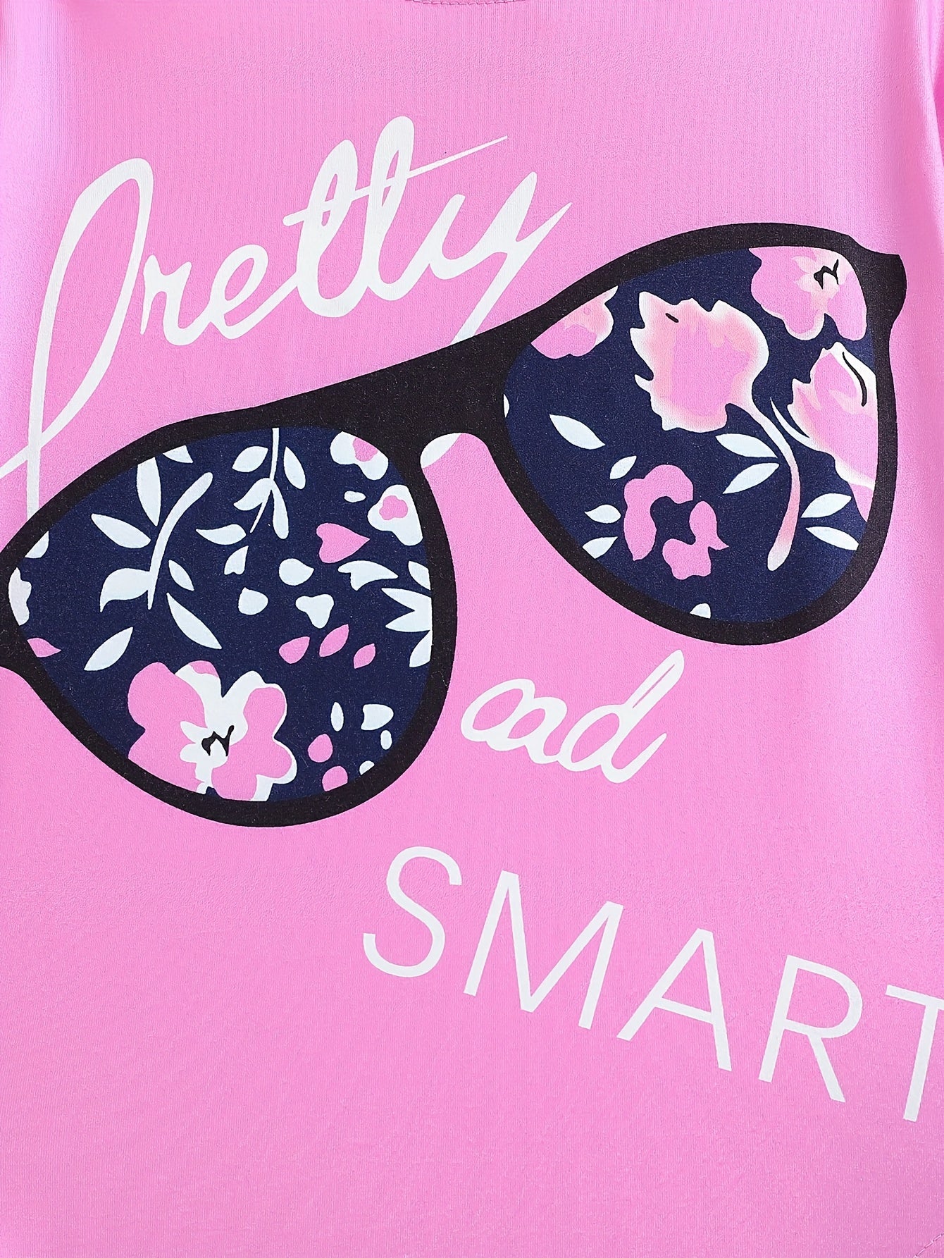 Ensemble de 2 pièces pour filles avec impression de grandes lunettes et motif de citation, t-shirt loose à épaules dénudées avec design asymétrique + leggins courts à imprimé floral du 4 au 8 ans
