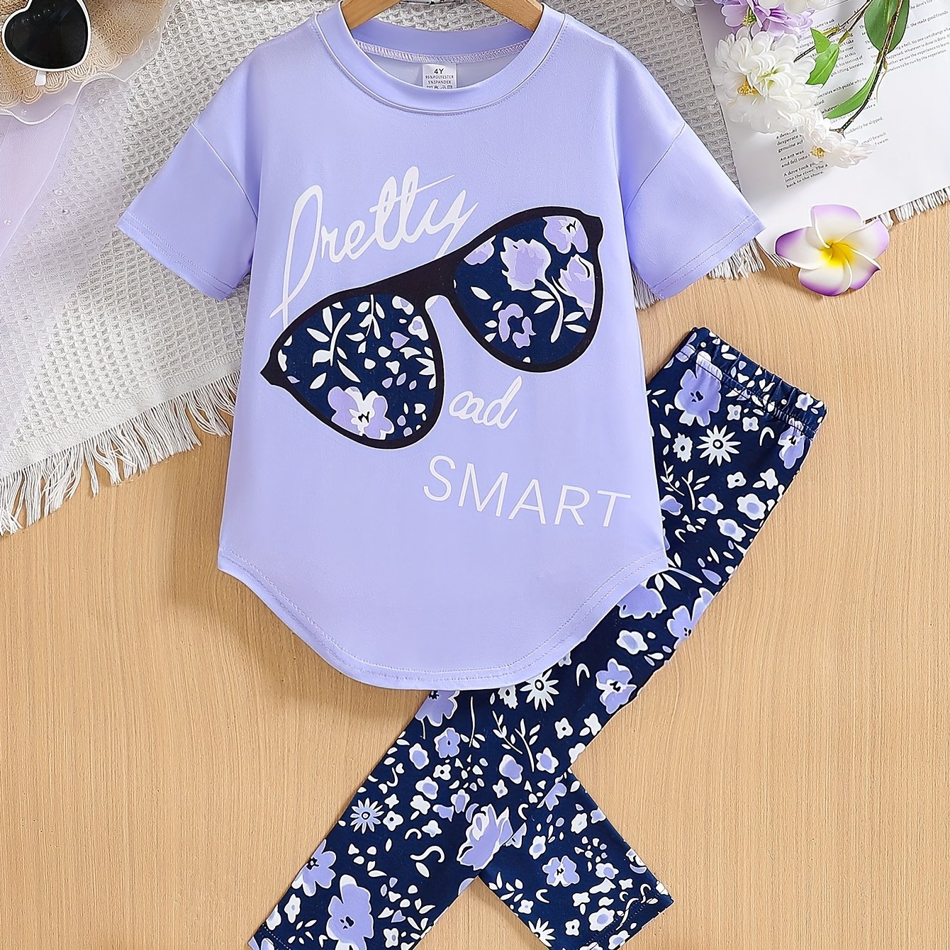 Ensemble de 2 pièces pour filles avec impression de grandes lunettes et motif de citation, t-shirt loose à épaules dénudées avec design asymétrique + leggins courts à imprimé floral du 4 au 8 ans