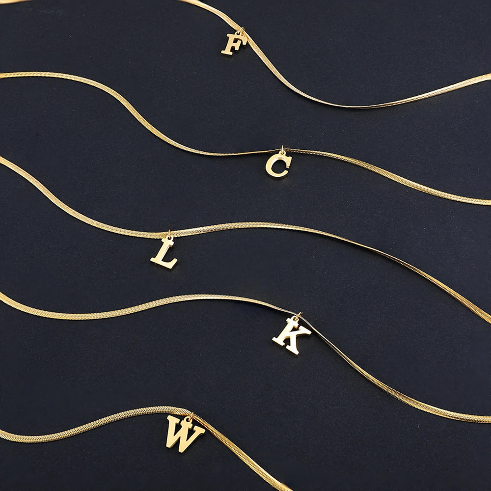 Pendentif  alphabet plaqué or inoxydable