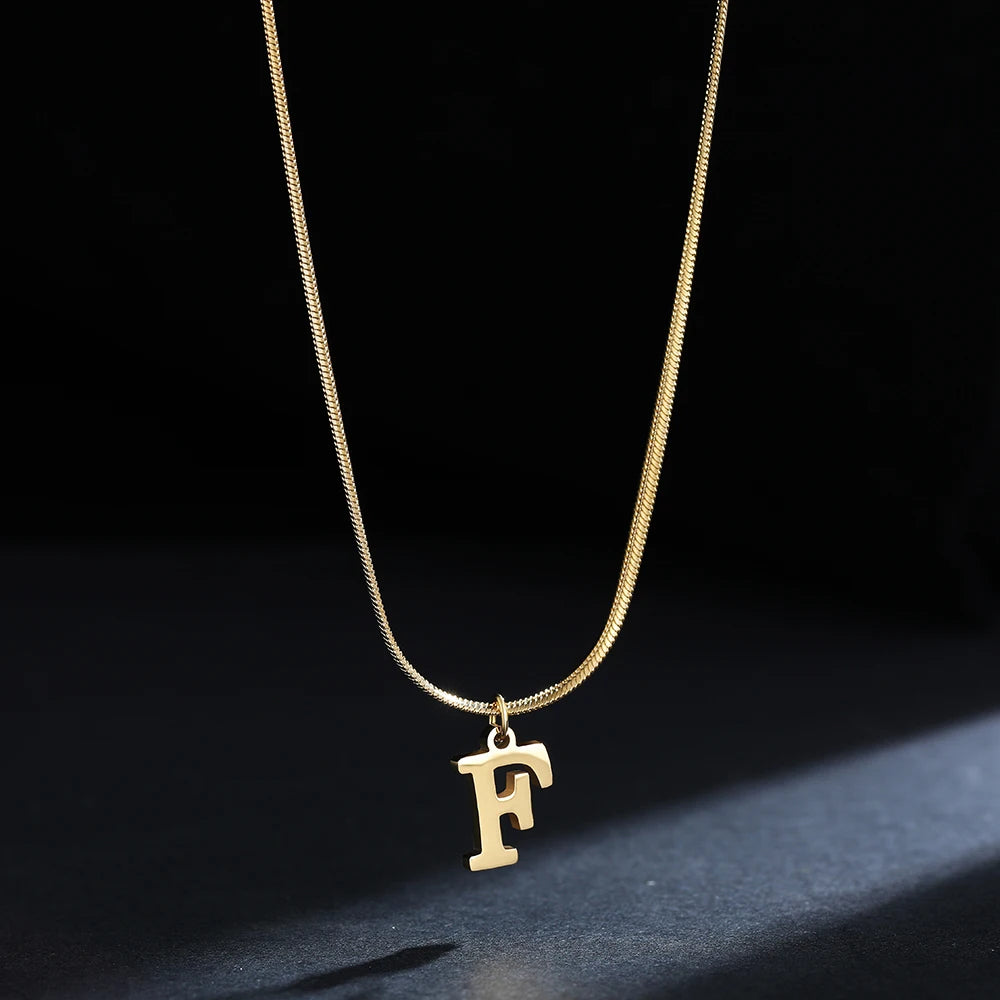 Pendentif  alphabet plaqué or inoxydable